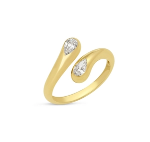 Macro view of bypass ring with two pear-cut cubic zirconia stones on gold band