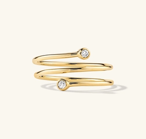 Detailed view of triple-layer spiral S925 silver ring with zircon stone in gold finish