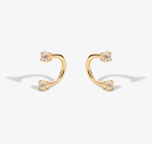 Detailed view of S925 silver U-shaped earrings with round zircon stones in gold finish