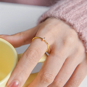 Minimalist S925 sterling silver gold ring with marquise-cut zircon on a model's finger