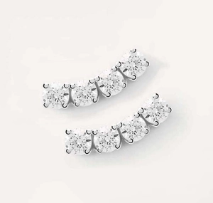 Close-up of S925 sterling silver curved earrings with five clear cubic zirconia stones