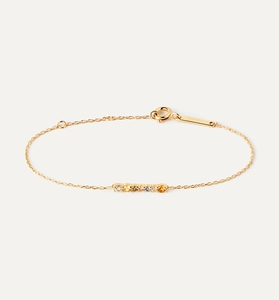 Detail of gold chain bracelet with colorful zircon bar and elegant spring clasp