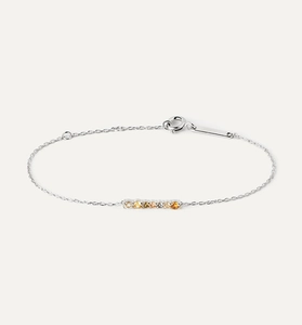 Macro view of S925 silver bracelet featuring gradient colored cubic zirconia stones