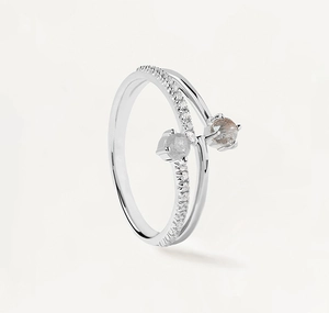 Detail of S925 sterling silver bypass ring with sparkling zircons and natural grey moonstone