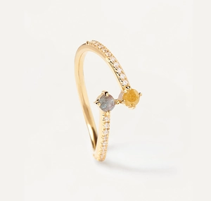 Close-up of S925 silver bypass ring with gray blue and yellow stones and white pavé accents