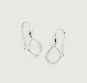 Macro shot of S925 sterling silver drop earrings with pavé set crystals on hollow geometric frames