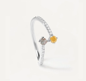 Detailed view of S925 sterling silver bypass ring with yellow and grey zircon stones