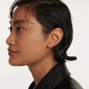 Minimalist S925 sterling silver curved bead ear cuff earring on model's ear