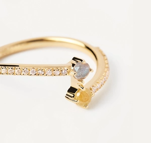 Macro detail of gold-plated silver ring with bicolor zircons and pavé setting