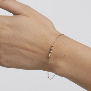 Elegant gold S925 sterling silver bracelet with multi-color zircon stones on wrist