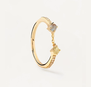 Detail view of gold open ring with dual gemstones linked by a fine gold chain and pavé stones