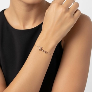 Minimalist S925 sterling silver love script bracelet in rose gold on woman's wrist