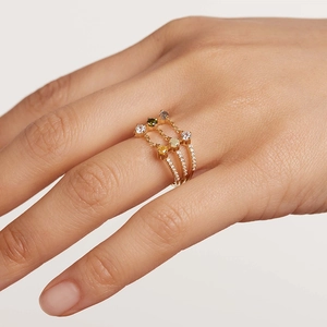 Three-layer gold chain ring with multi-color gemstones and sparkling diamonds on a model