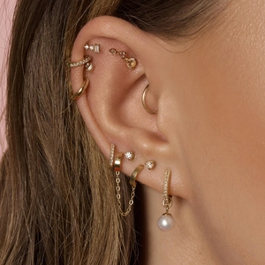 Luxurious gold S925 earrings set with sparkling zircon and pearl pendant for a layered look