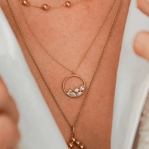 Elegant gold layered S925 silver necklace featuring a zircon pendant and beaded chains