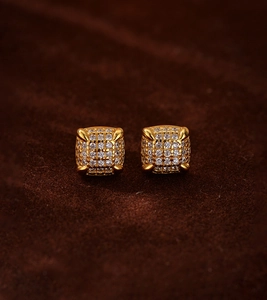 Macro detail of 18K gold-plated square stud earrings featuring micro-pave cubic zirconia