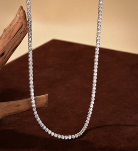 Detailed close-up of a shimmering S925 silver tennis chain with micro-pave set round diamonds