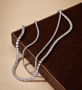 Macro shot of two S925 sterling silver tennis necklaces with sparkling cubic zirconia crystals