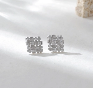 Close-up of S925 sterling silver square lattice earrings with sparkling diamond accents