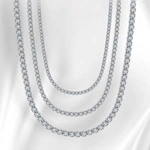 Detailed close-up of three layered silver S925 tennis chains with shimmering zircon stones