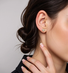 Detail of square gold plated 925 silver stud earrings with micro pave zircon stones