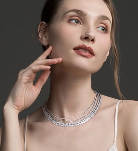 Detail of layered S925 sterling silver tennis necklaces with shimmering micro-pave zircons