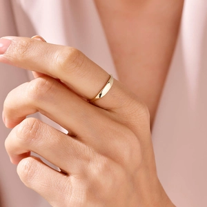 Minimalist polished gold dome ring for women shown on index finger for elegant daily wear