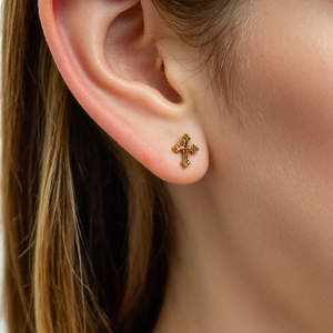 Minimalist 18K gold-plated S925 silver cross stud earring worn on earlobe for women