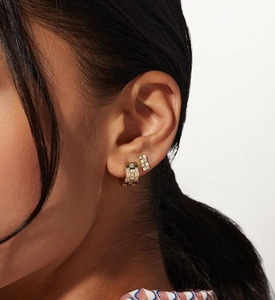 Close-up of gold-plated checkered hoop earrings with micro-inlaid zircon on ear model