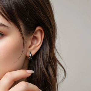 Minimalist S925 sterling silver geometric multifaceted earrings shown on a model