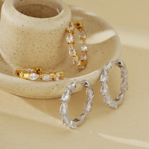 Elegant S925 silver hoop earrings with teardrop cubic zirconia in gold and silver finish