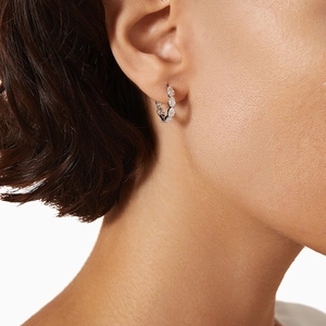 Elegant S925 sterling silver hoop earrings featuring marquise-cut zircons on a model