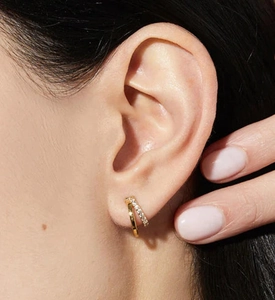 Close-up of 925 sterling silver double-layered ear cuff with sparkling pavé zircon stones
