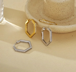 Macro detail of S925 sterling silver hexagonal earrings with micro-pave white zircon stones