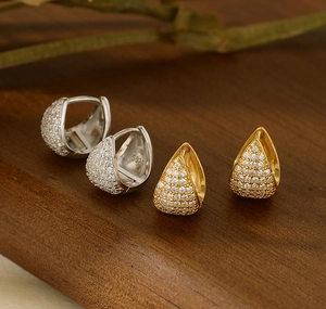 Detailed view of S925 sterling silver triangle hoop earrings with full zircon inlay