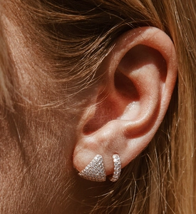 Close-up of sparkling S925 silver triangular and circular earrings with full diamond pavé