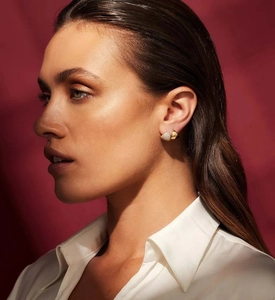 Close-up of elegant S925 silver asymmetric triangular earrings with micro-pave diamonds