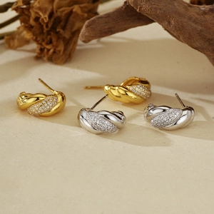 Twisted 925 sterling silver stud earrings with sparkling pavé cubic zirconia in gold and silver