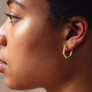 Luxurious gold S925 sterling silver hexagon hoop earrings with pavé crystals on model
