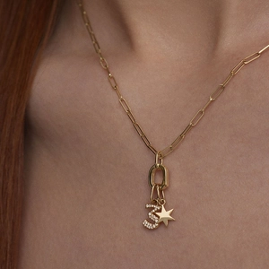 Gold paperclip chain necklace with a cubic zirconia number 3 and polished star pendant