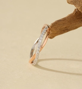 Close-up of dual-tone S925 silver ring with rose gold band and micro-set cubic zirconia