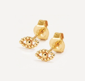 Macro detail of gold plated S925 silver evil eye stud earrings with beaded edge
