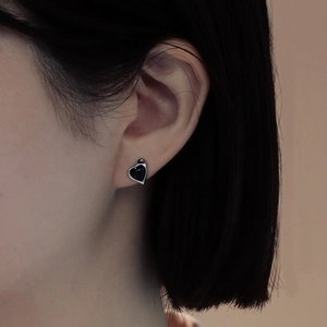 S925 sterling silver heart stud earrings with black onyx on a female model