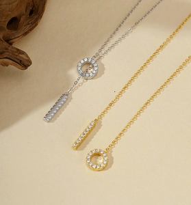 Detailed comparison of gold and silver lariat necklaces with micro-pave crystals