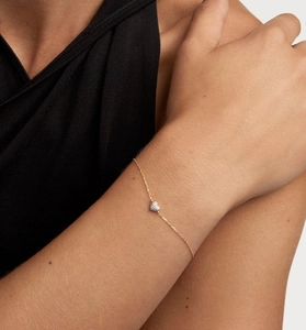 Close-up of S925 sterling silver heart bracelet with sparkling pavé cubic zirconia