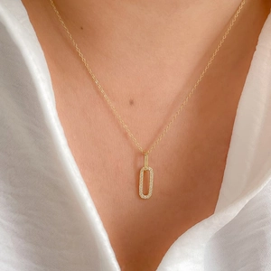 Close-up of S925 silver gold necklace with rectangle micro-pave diamond buckle pendant