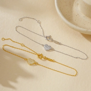 Sparkling S925 sterling silver heart bracelets with pavé zircons in gold and silver finish