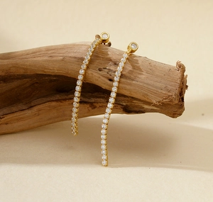 Close-up of elegant S925 silver long fringe tassel earrings with shiny cubic zirconia stones