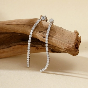Elegant long S925 sterling silver tassel earrings with sparkling zircon on natural wood