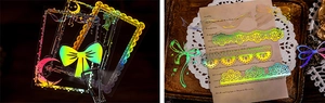 Vue macro d'autocollants laser irisés avec cadres baroques et motifs dentelle